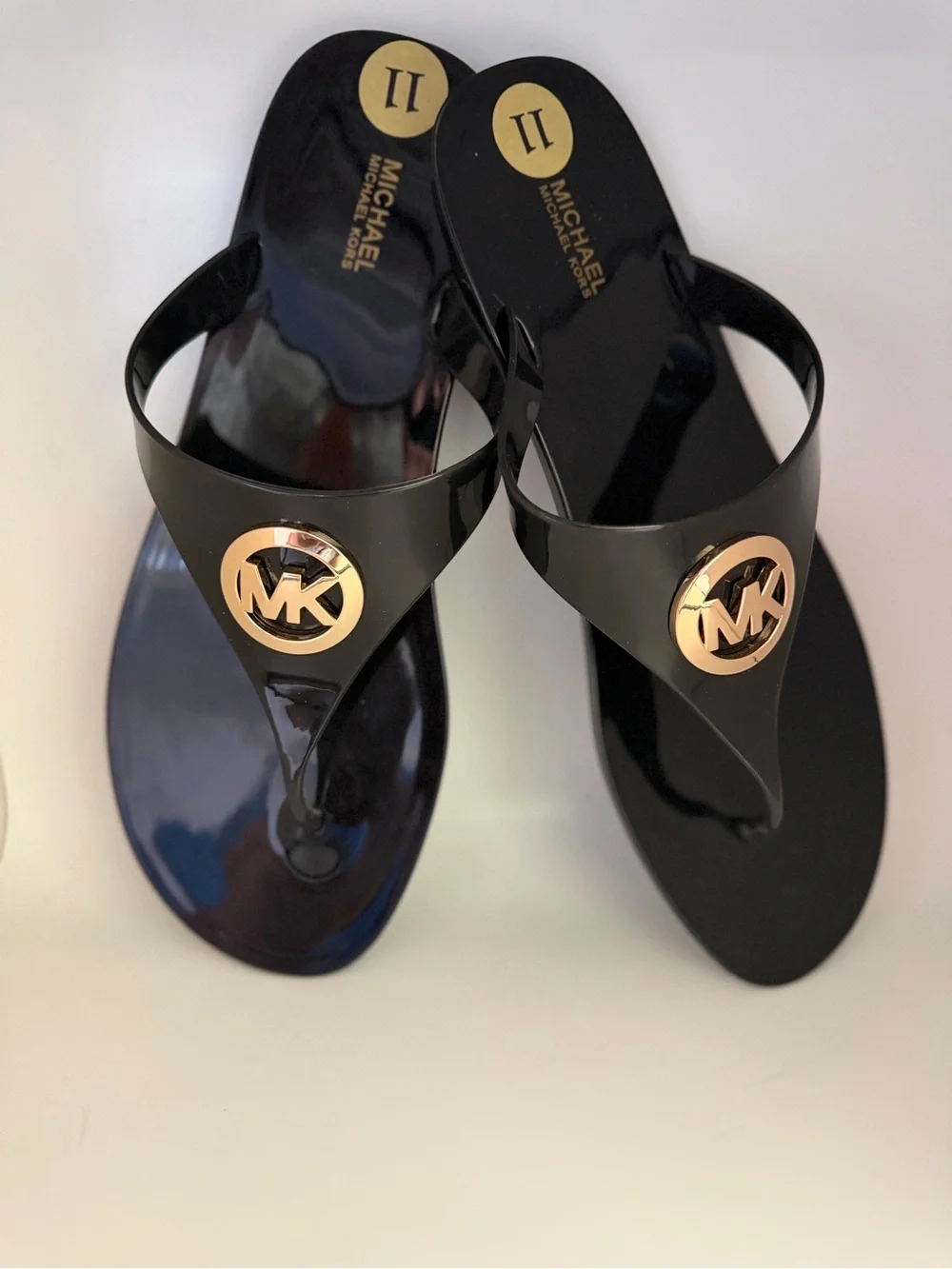 Michael Kors Black Patent Logo Jelly Thong Sandals with Gold Emblem